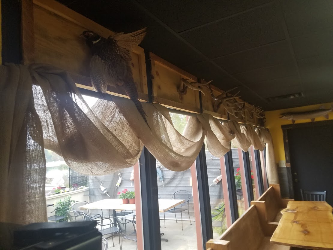 Smokey Water Rib Co rustic lakeside dining room interior.