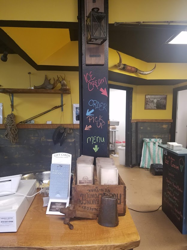 Hand-lettered order and ice-cream chalkboard inside the restaurant.